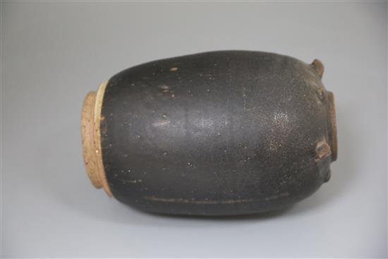 A Chinese Henan dark brown glazed jar, Song-Yuan dynasty, H. 23cm